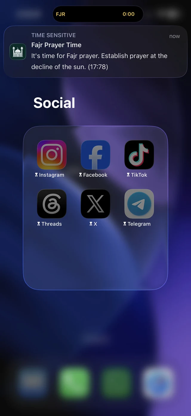 An iPhone showing the Fajr prayer notification from Athanify above the Social folder, where Instagram, Facebook, TikTok, Threads, X and Telegram each wear the Screen Time hourglass, meaning they are locked